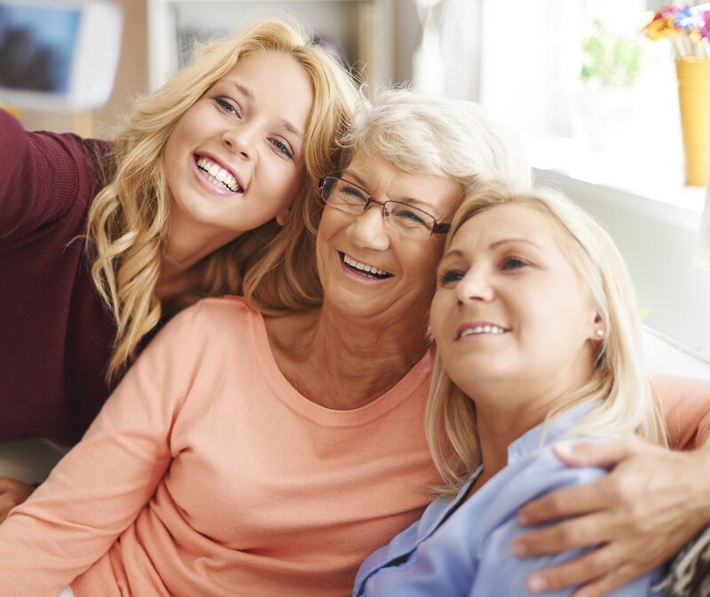 three generations of women smiling